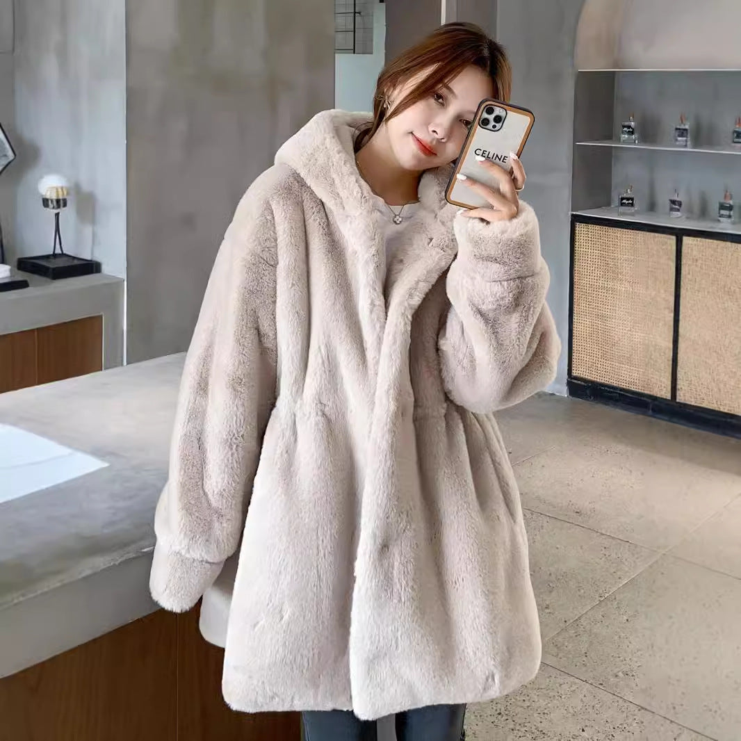 Long women's faux fur coat with hood and tailoring