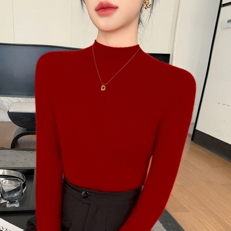 Women's knitted pullover with stand-up collar, fitted