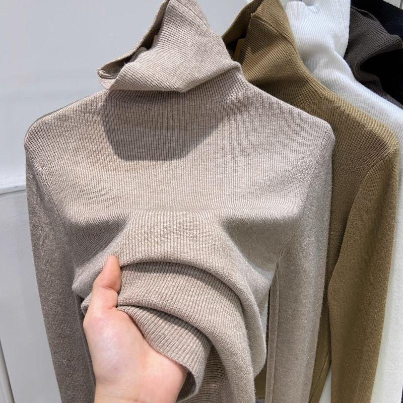 Slimming women’s knitted sweater with stand-up collar