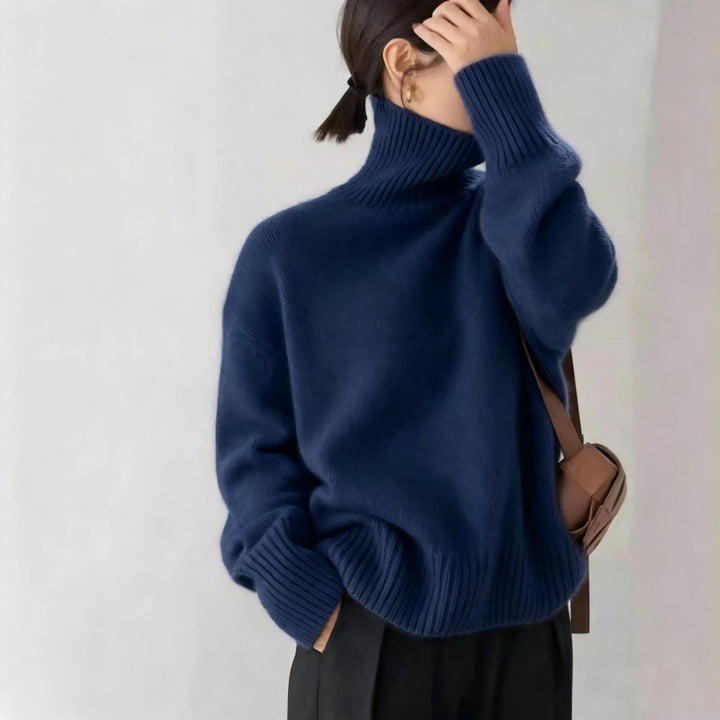 Loose women's knitted sweater with turtleneck
