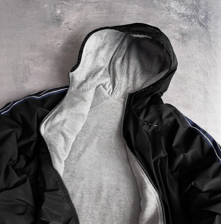 Veste de coupe-vent pour femmes avec capuche doublée et poches latérales Chic & Stil