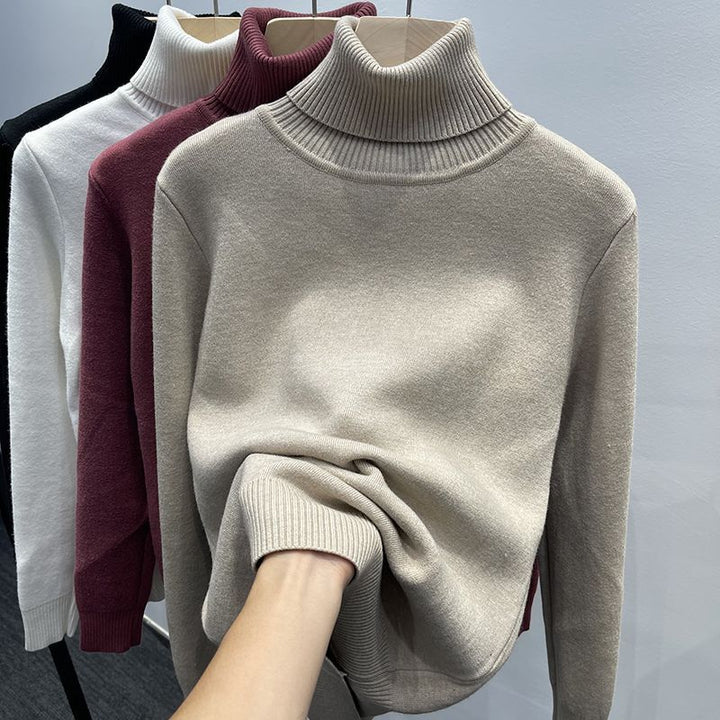 Padded women's knit sweater with high collar