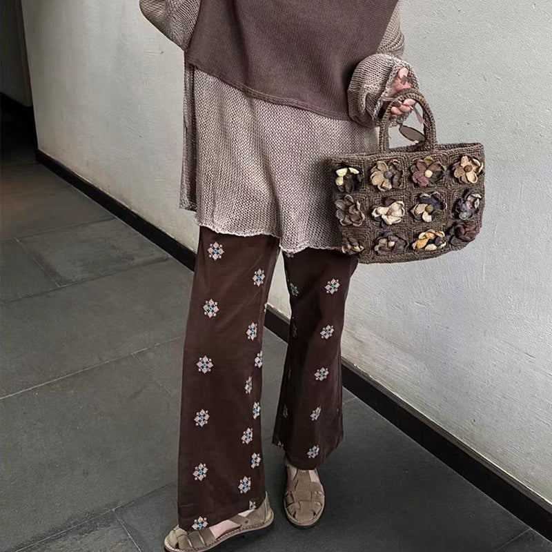 Cord pants with embroidery and flared leg