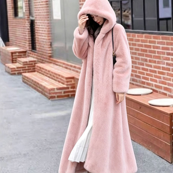 Long women's coat made of faux fur with hood