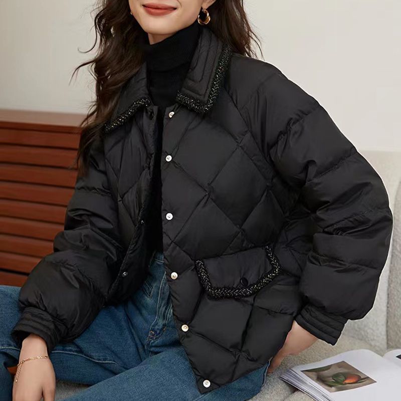 Short women's quilted jacket in diamond design