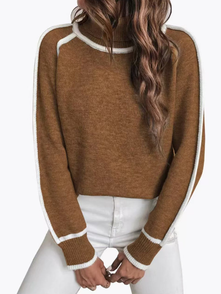 Women's knit pullover with stand-up collar and contrast details