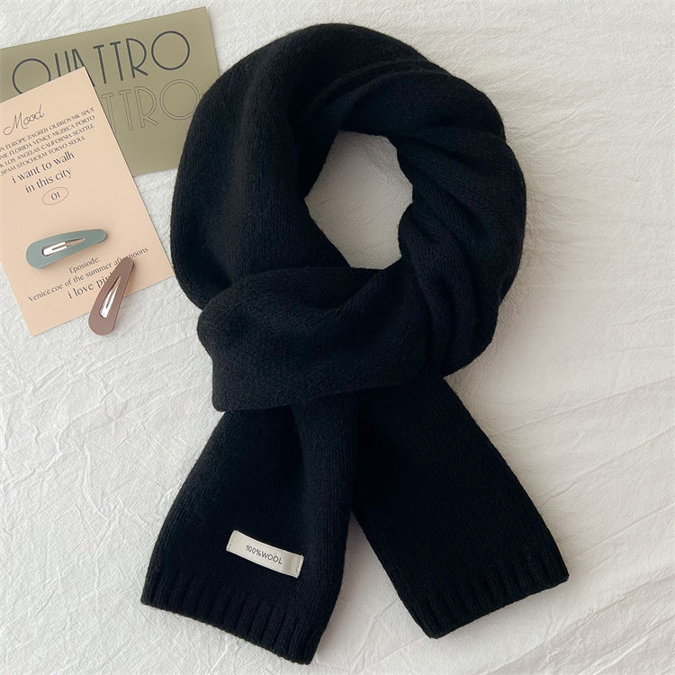 Simple knitted scarf made of pure wool