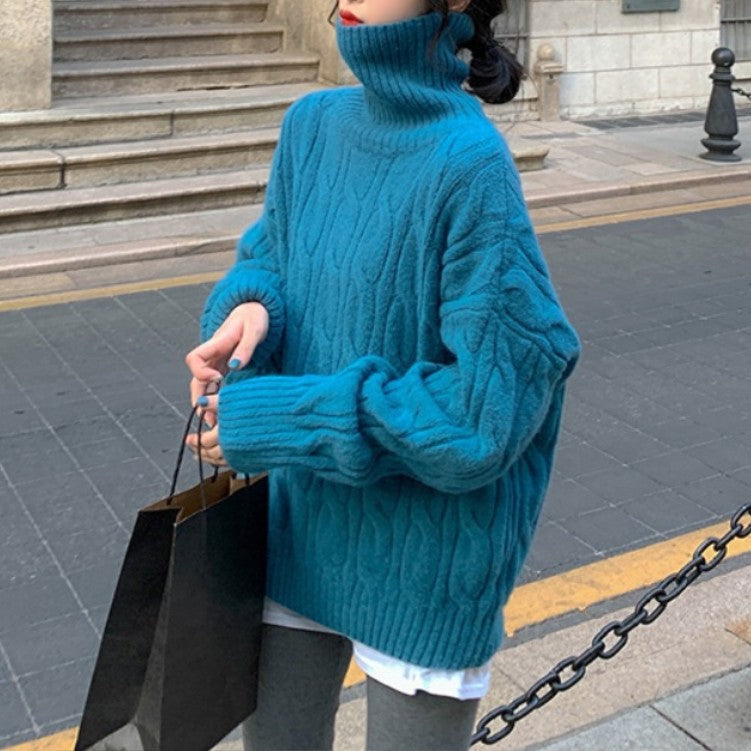 Women’s knit sweater with cable pattern and roll neck