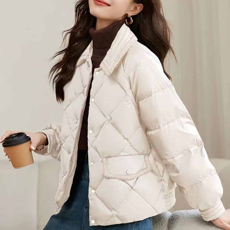 Short women's quilted jacket in diamond design