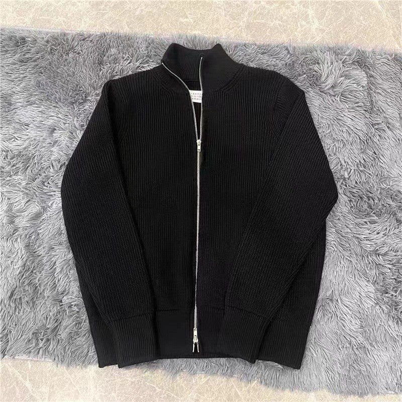 Loose women's knit sweater with zipper and stand-up collar