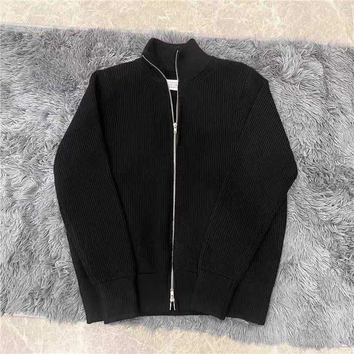 Loose women's knit sweater with zipper and stand-up collar