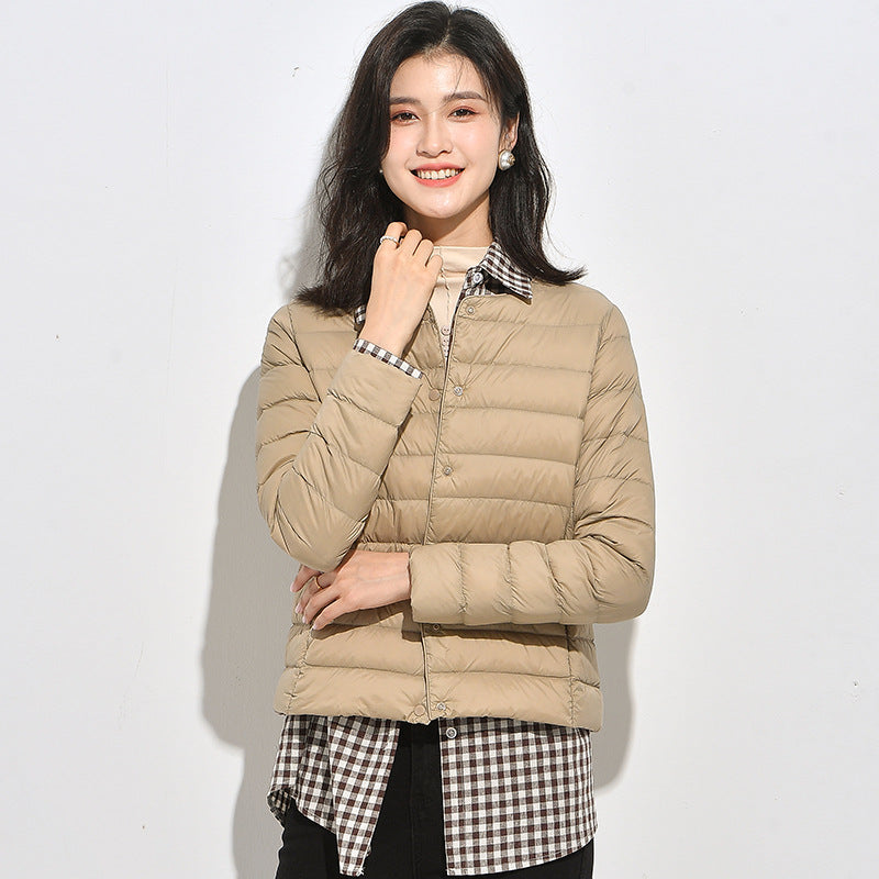 Light women's down jacket, short, as a base layer jacket