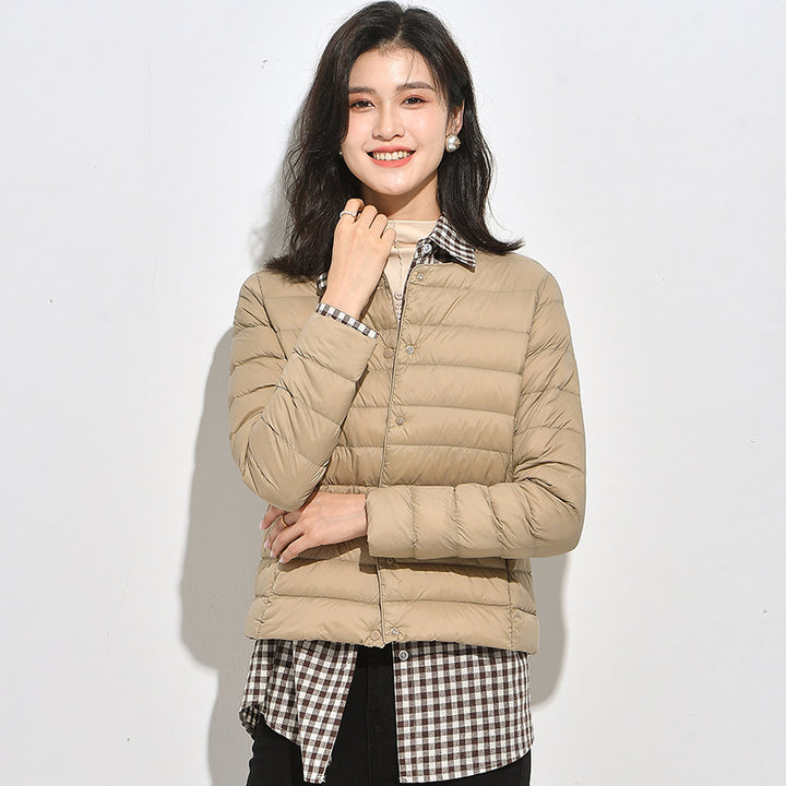 Light women's down jacket, short, as a base layer jacket