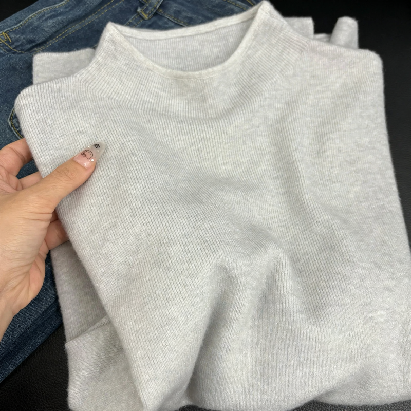 Slim women's knitted sweater with stand-up collar