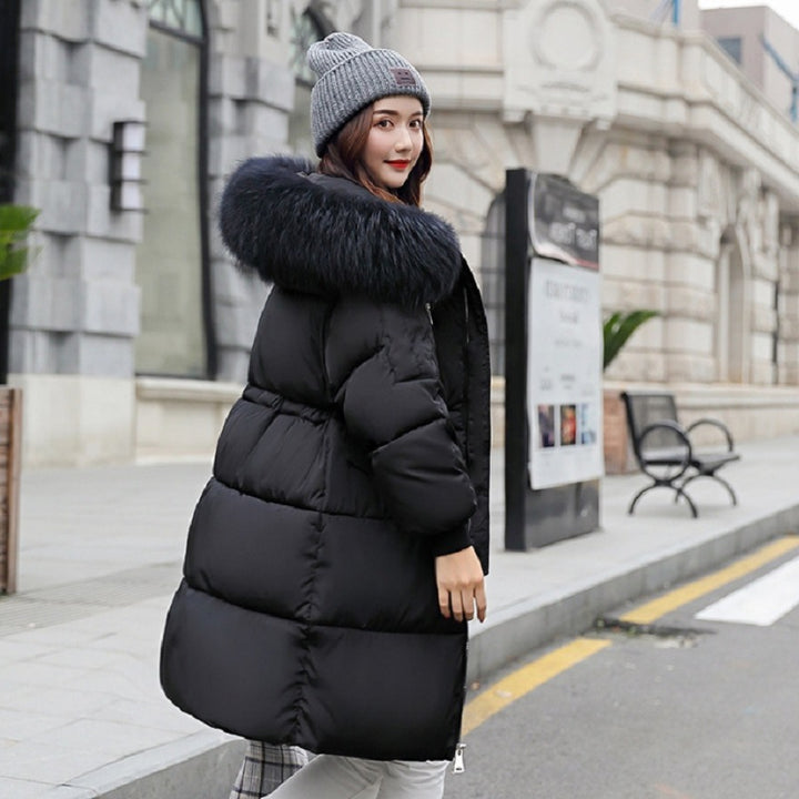 Padded women's winter jacket, mid-length, with fur collar