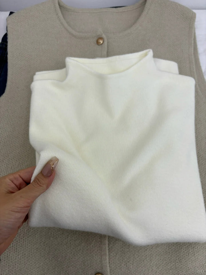 Slim women's knitted sweater with stand-up collar