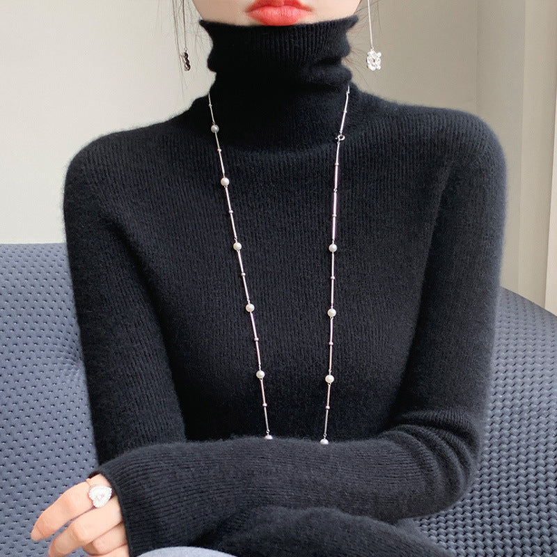 Women's knitted pullover with stand-up collar, fitted
