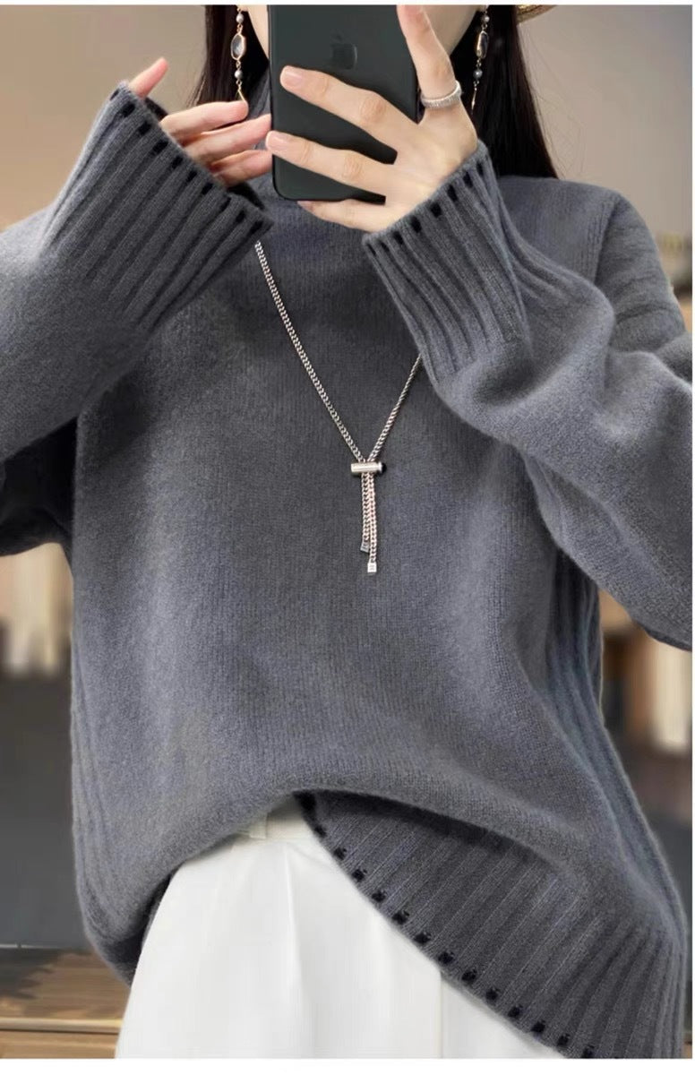 Women's knit sweater with cable pattern and turtleneck