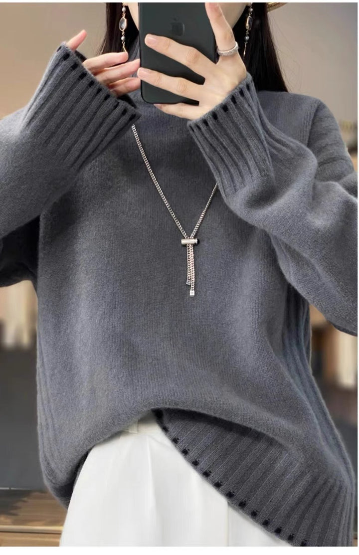 Women's knit sweater with cable pattern and turtleneck