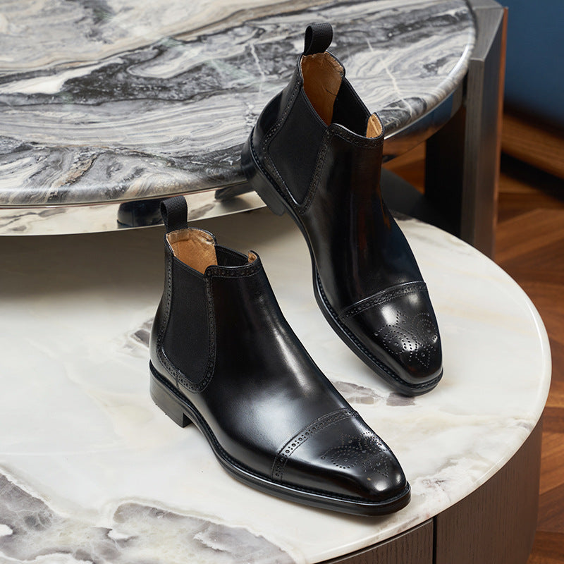 Men's Chelsea boots made of leather, brogue design, round