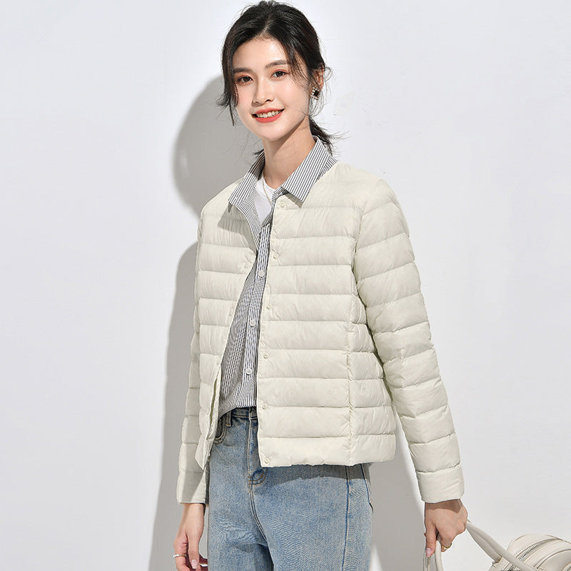 Light women's down jacket, short, as a base layer jacket