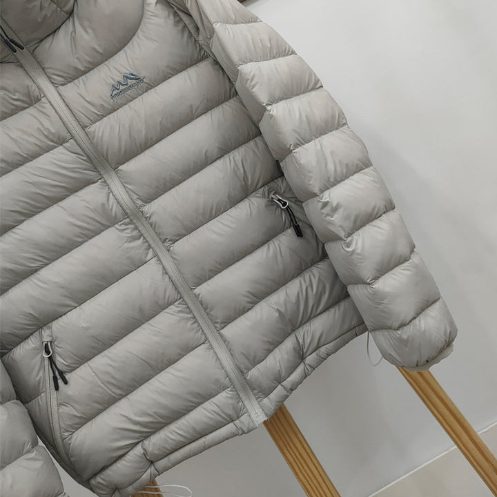Light women's down jacket with hood, quilted