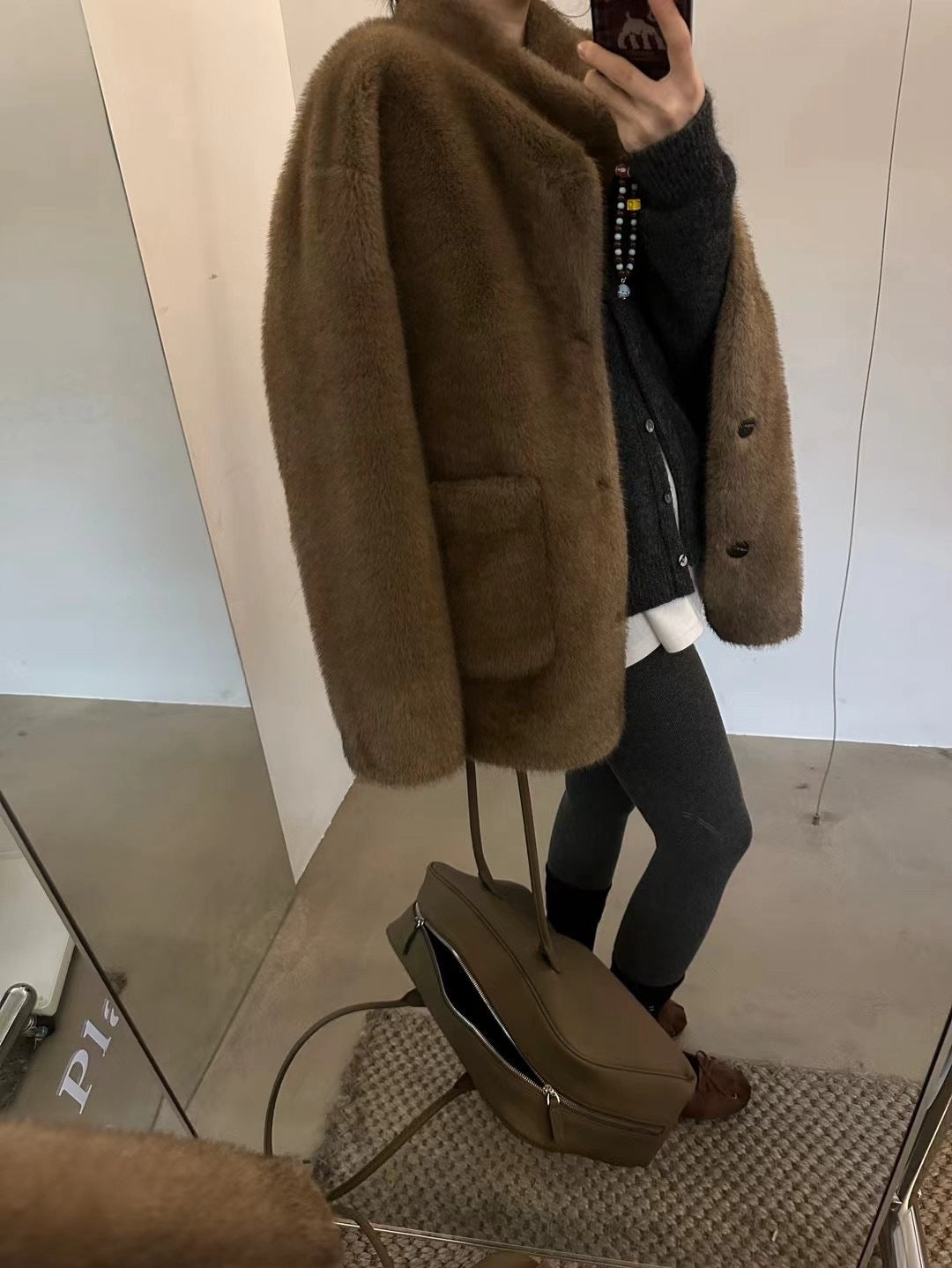 Fashionable faux fur coat, mid-length and lined