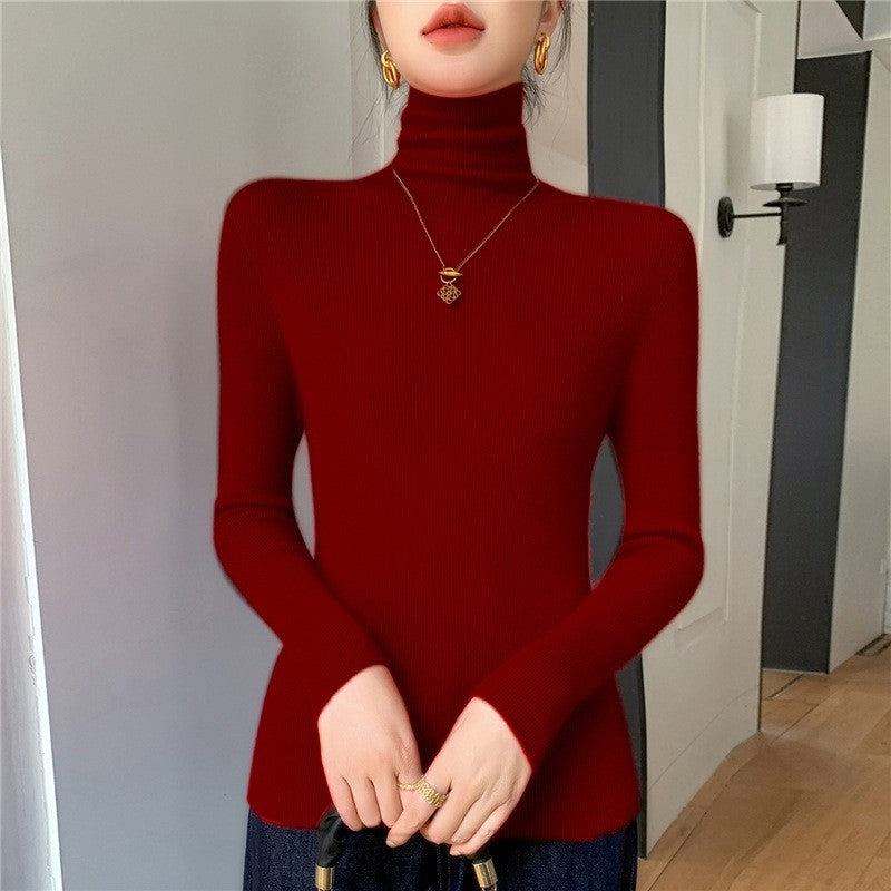 Women's knitted pullover with stand-up collar, fitted