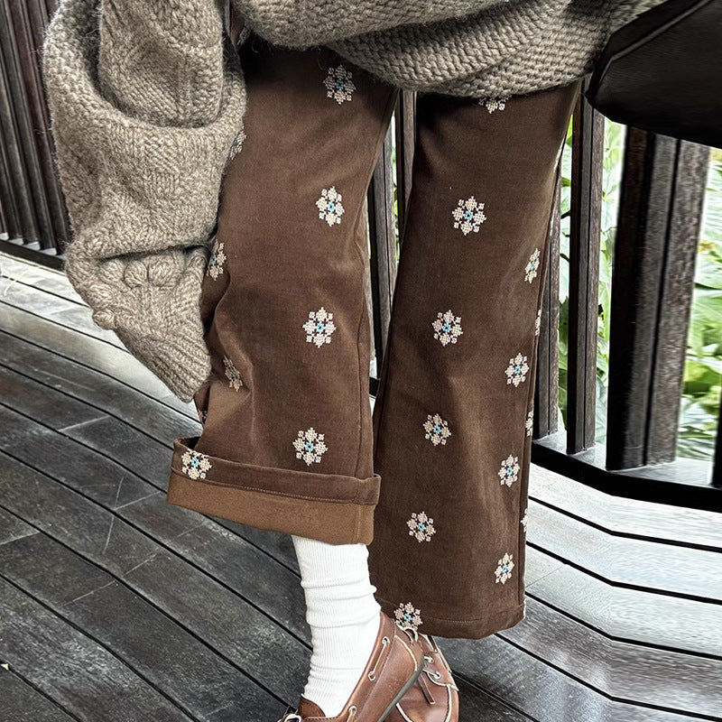 Cord pants with embroidery and flared leg
