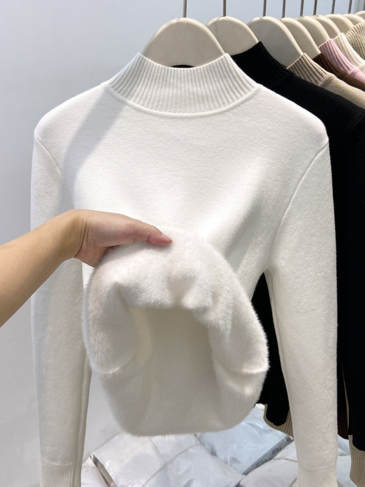 Padded women's knit sweater with high collar