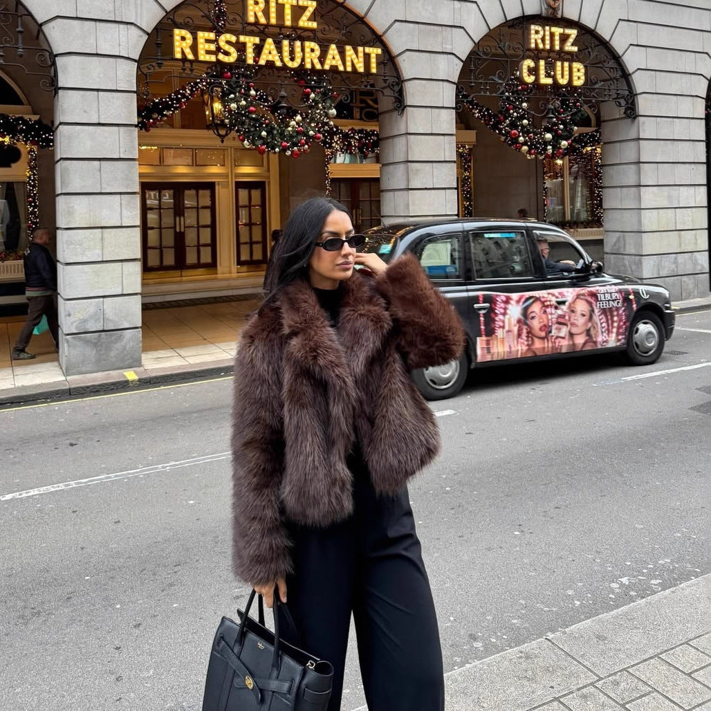 Fashionable women's faux fur coat in coffee brown