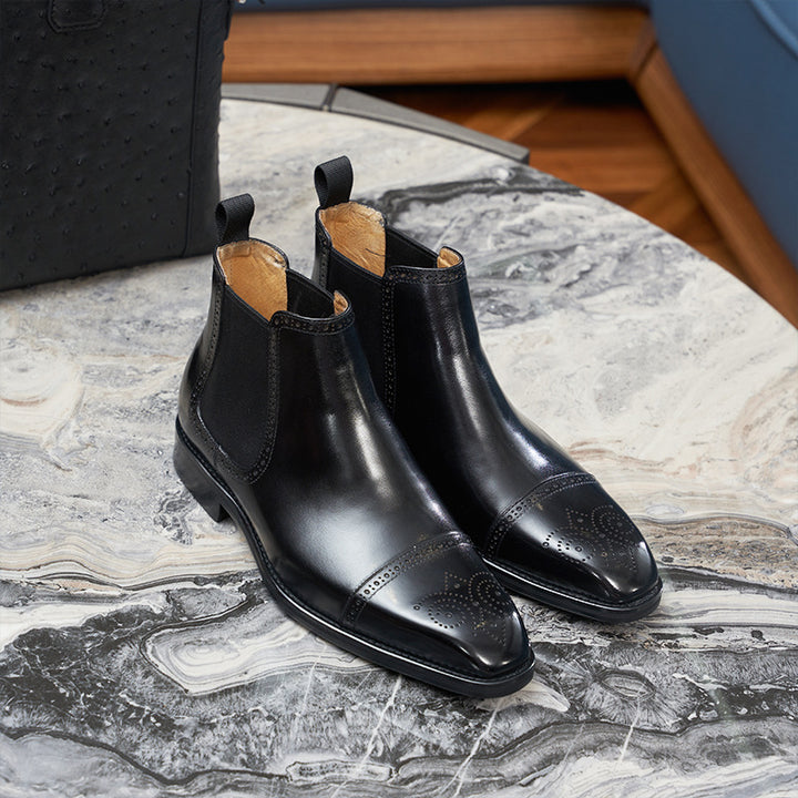 Men's Chelsea boots made of leather, brogue design, round