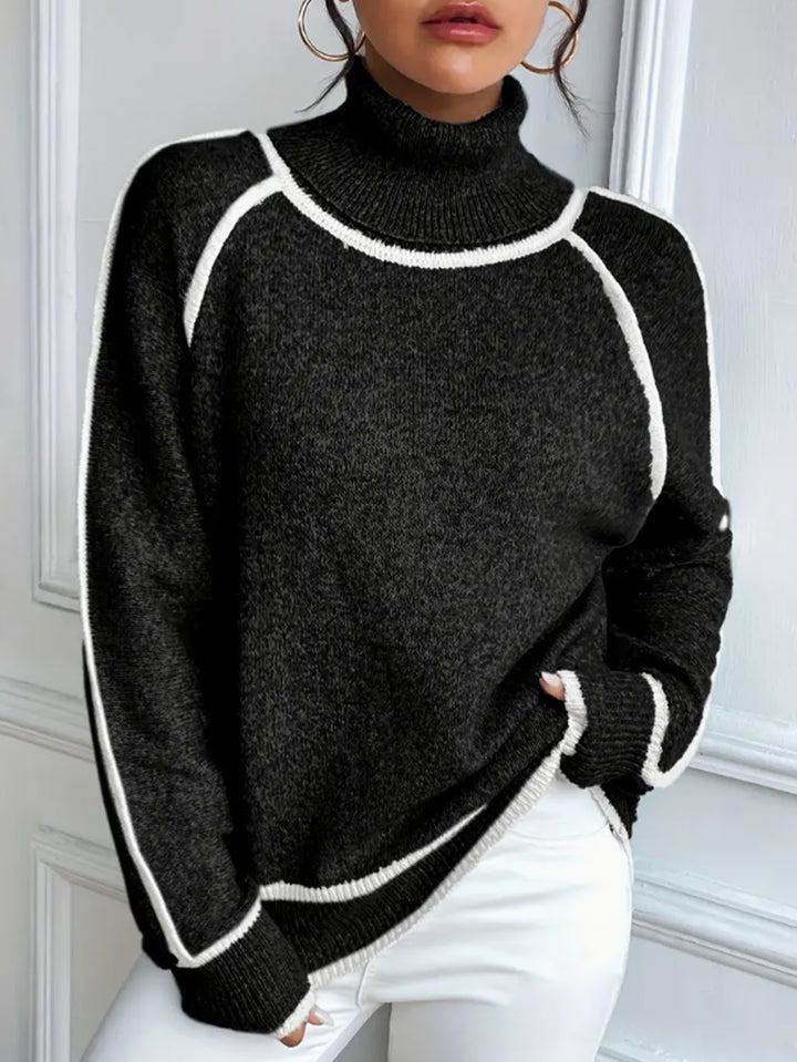 Women's knit pullover with stand-up collar and contrast details