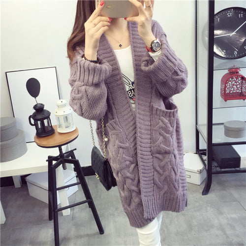 Chunky knit cardigan for women with elegant braided pattern and practical pockets Amarae