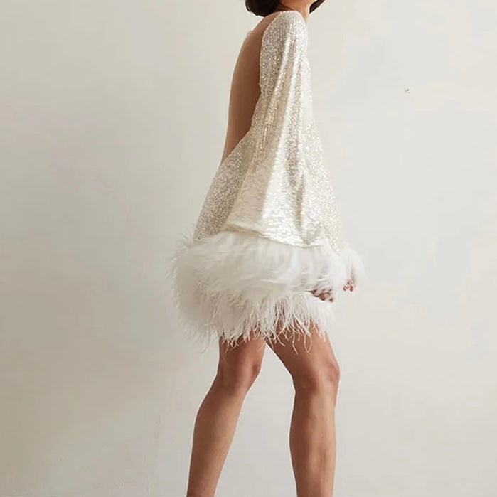 Lune London | Glamorous dress with sequins and feather hem