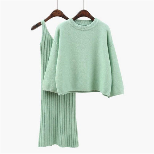 Women’s fashionable knitted set with a comfortable oversized sweater and a chic fitted dress.