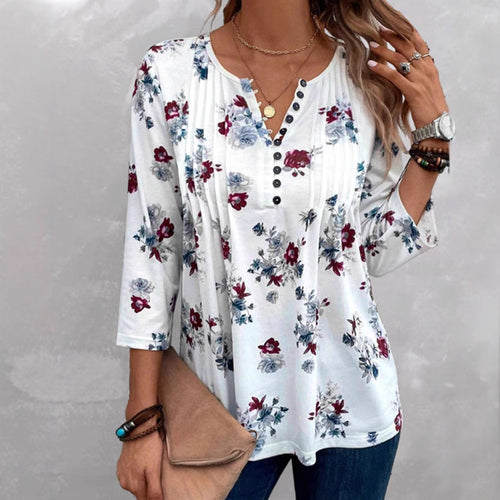 Blouse pour femmes avec imprimé floral et détails de boutons Chic & Stil