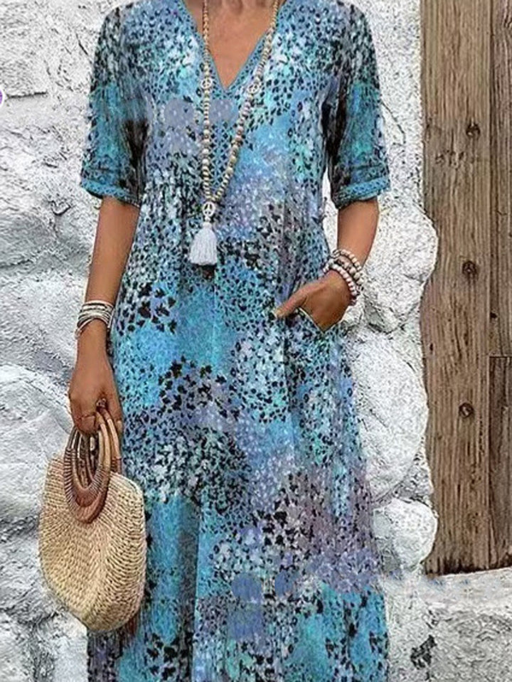 Maxi dress for women with V-neckline and practical side pockets Lune London