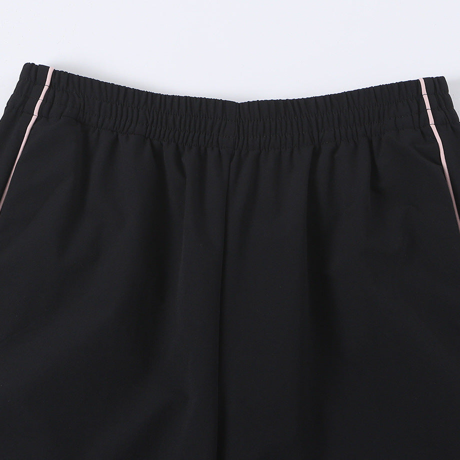 Women wide training pants with contrasting piping and elastic waistband Amarae