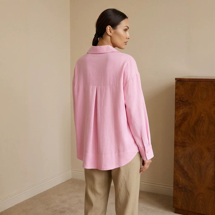 Women's loose-fitting tunic blouse with V-neck, shirt collar, and extended back hem Amarae