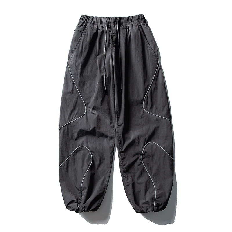Men's loose utility harem pants made of ripstop with drawstring waistband, shaped panels, and elastic ankle cuffs Amarae
