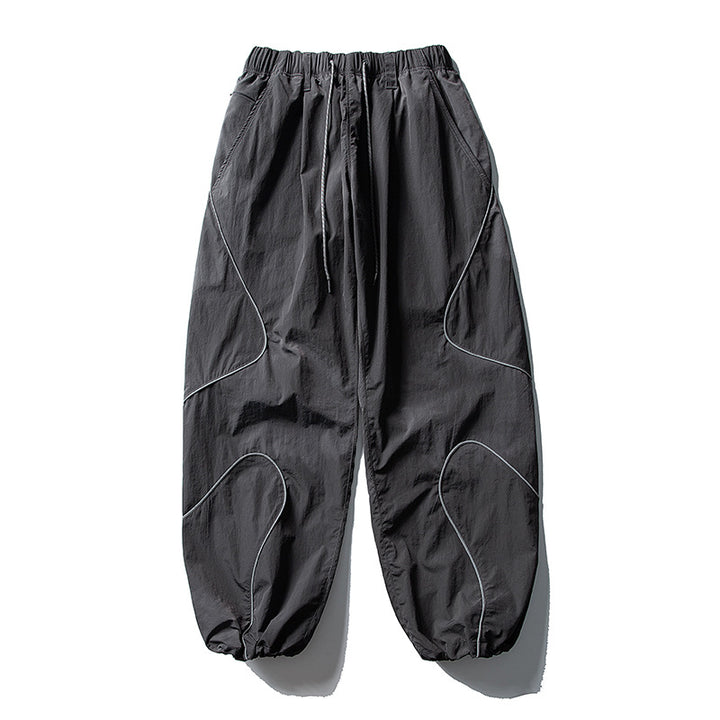 Men's loose utility harem pants made of ripstop with drawstring waistband, shaped panels, and elastic ankle cuffs Amarae