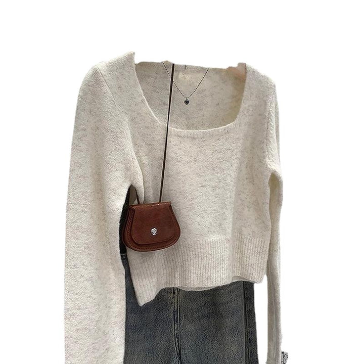 Pull féminin tendance avec encolure ronde large et texture fine Chic & Stil