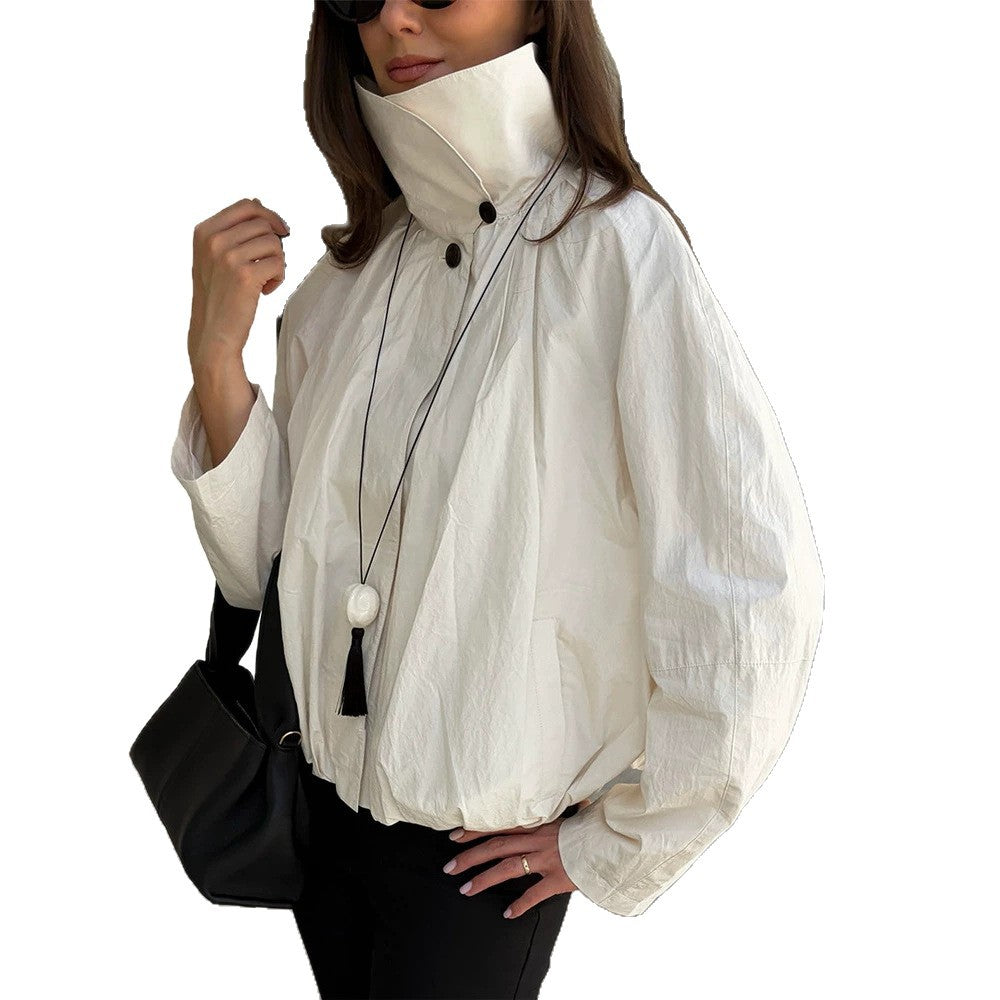 Women's short jacket with high stand-up collar, gathered shoulder area, and elastic hem Amarae