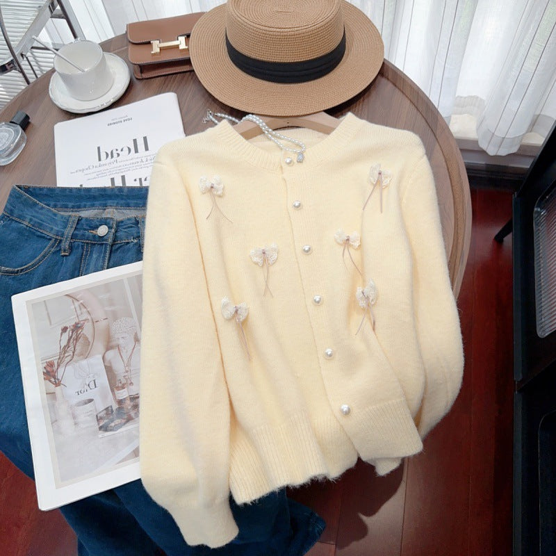 Knit jacket for women with feminine appliques and chic button details