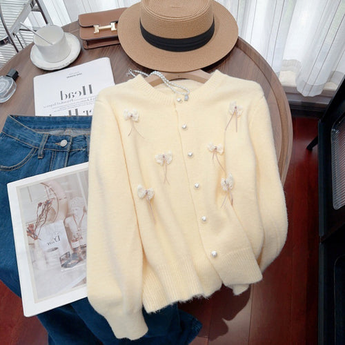 Knit jacket for women with feminine appliques and chic button details