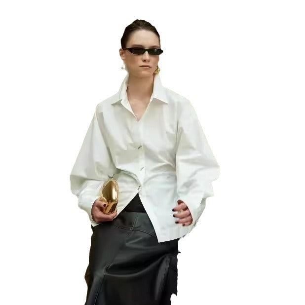 Blouse designer femme avec des manches volumineuses et des détails de boutons exquis Chic & Stil