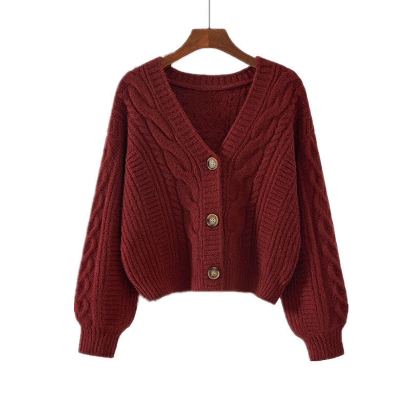Ladies cozy knitted pullover with cable pattern and button closure Lune London