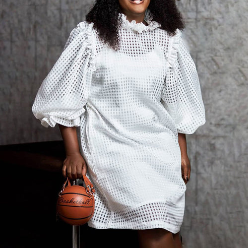 Transparent dress for women with voluminous puff sleeves and a chic check pattern.