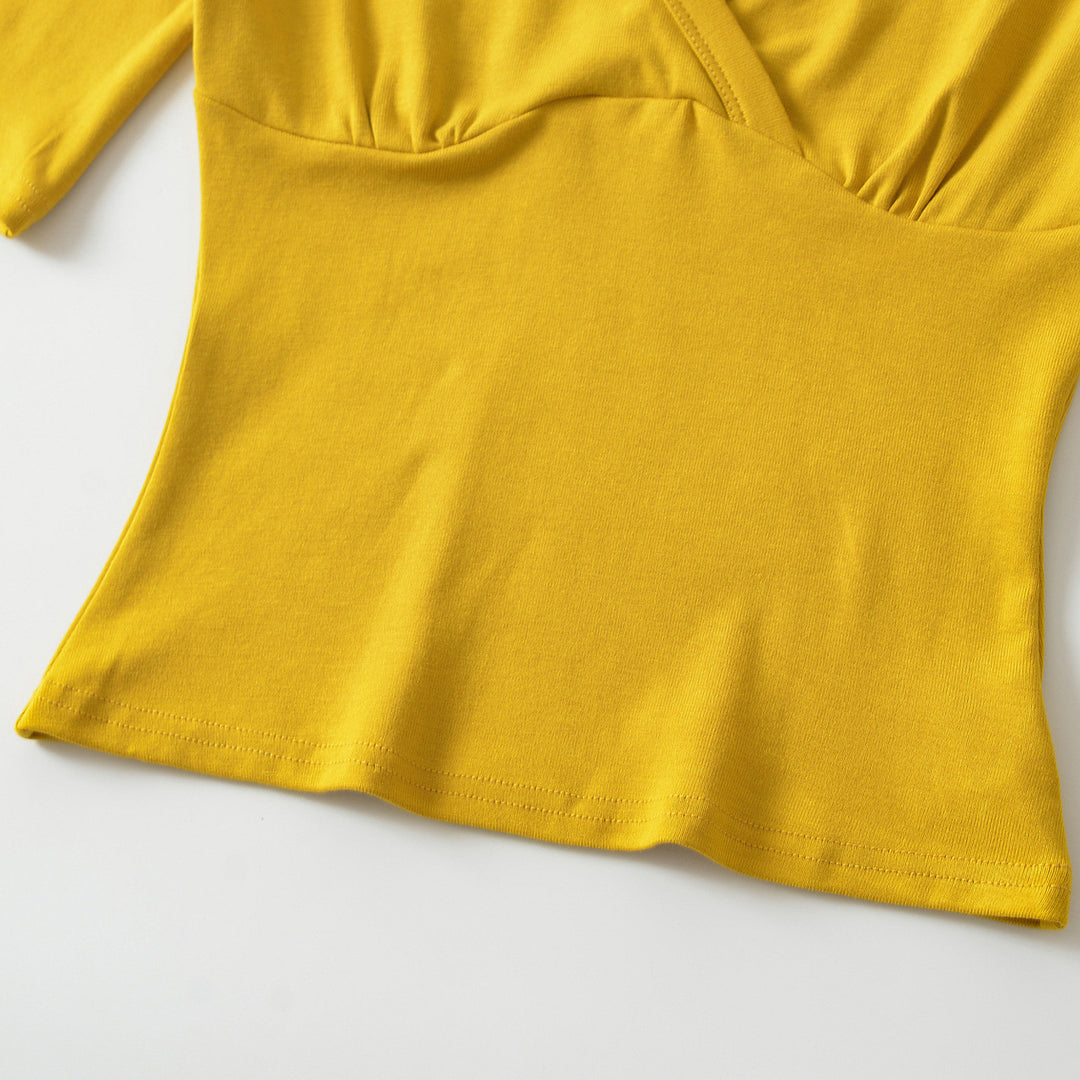 Women's body-hugging wrap shirt with deep V-neck, three-quarter sleeves, and waist accentuation Amarae